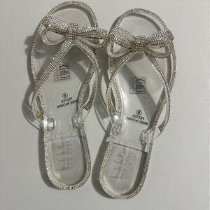 Nicole Miller jelly sandals. Bow with rhinestones. Never worn. Size 8